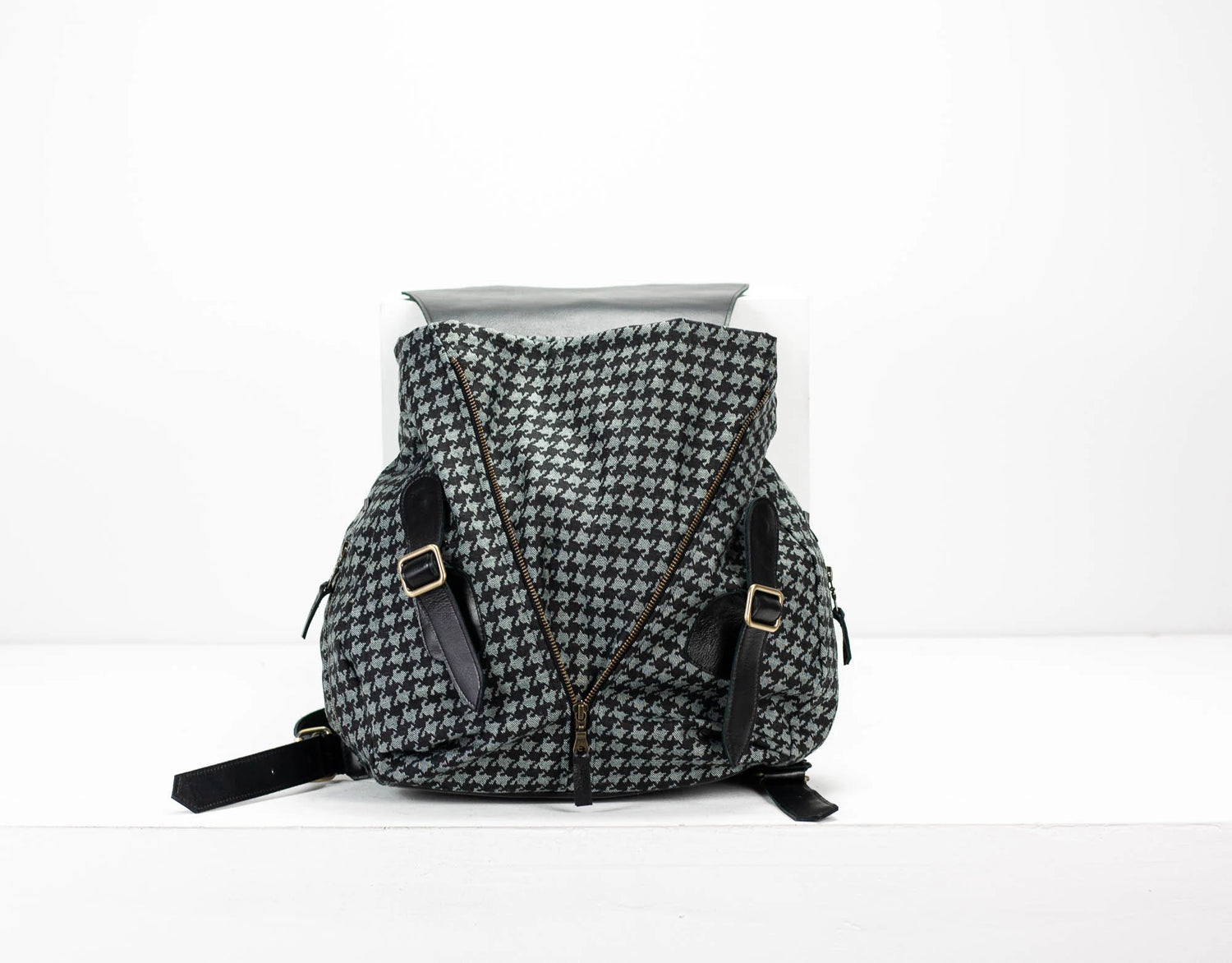 Houndstooth pattern backpack on a white background