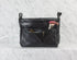 Black leather handbag with makeup brushes on a light gray background