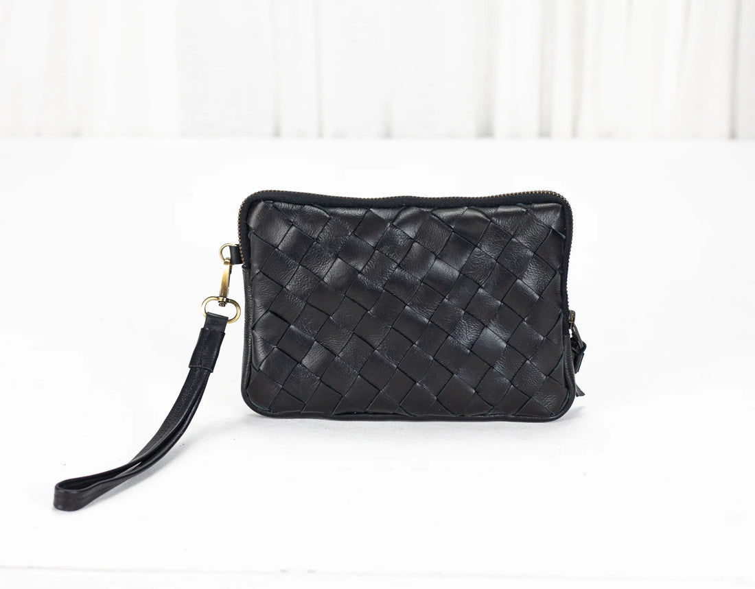 Black woven handbag on a white background