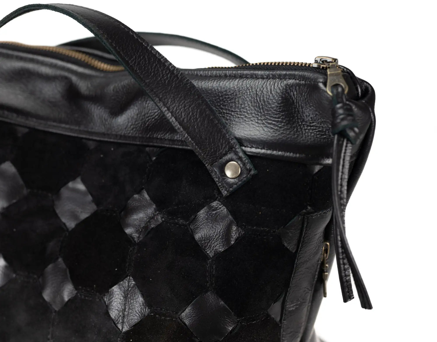 Black textured leather bag with a zipper on a white background