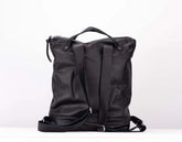 Black leather backpack on a white background