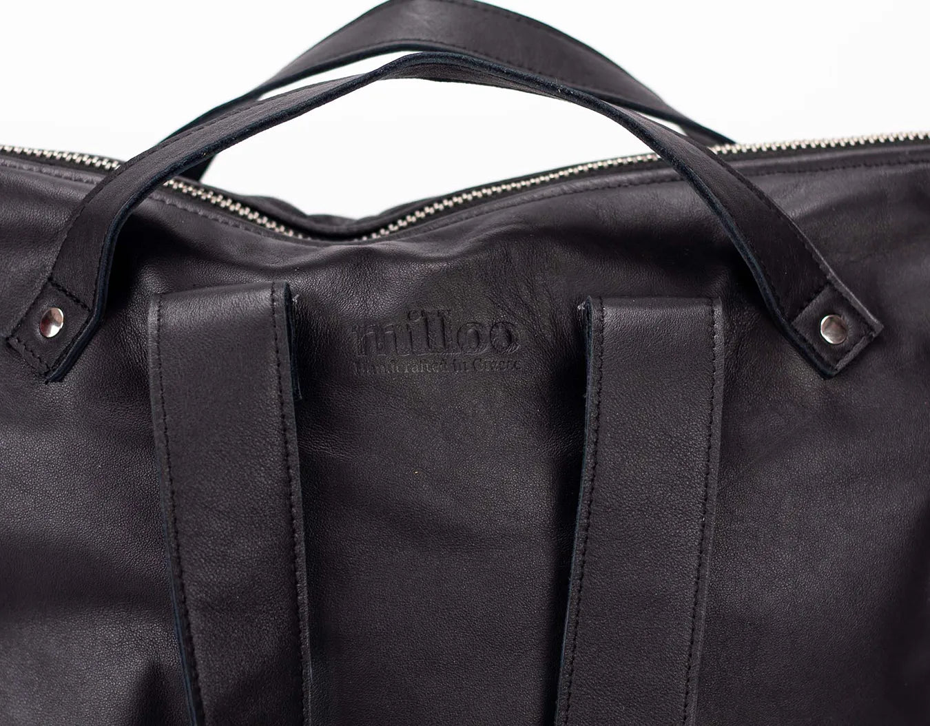 Black leather bag with visible brand logo on a white background