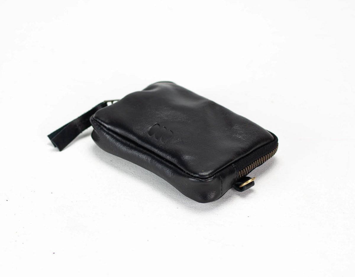 Black leather pouch with gold zipper on a white background#color_black