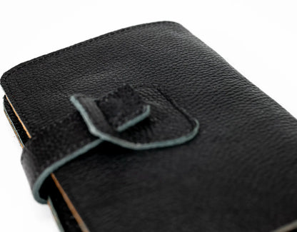 Black leather wallet with a strap on a white background