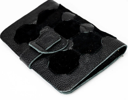 Black leather wallet with a buckle on a white background