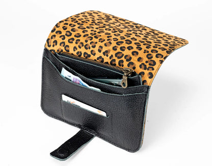 Small pouch with leopard print top and black interior on a white background