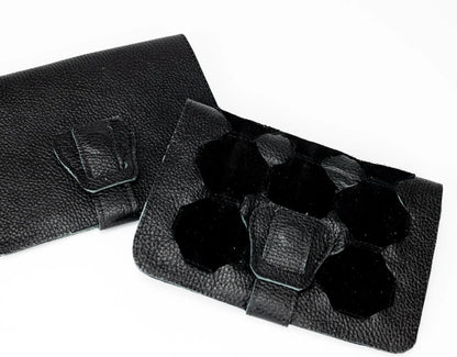 Black leather case with a strap on a white background