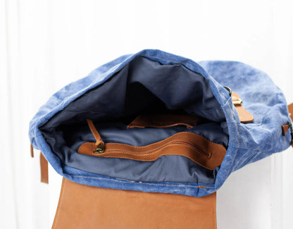 Blue and brown backpack on a white background