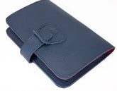 Blue leather wallet with a strap on a white background