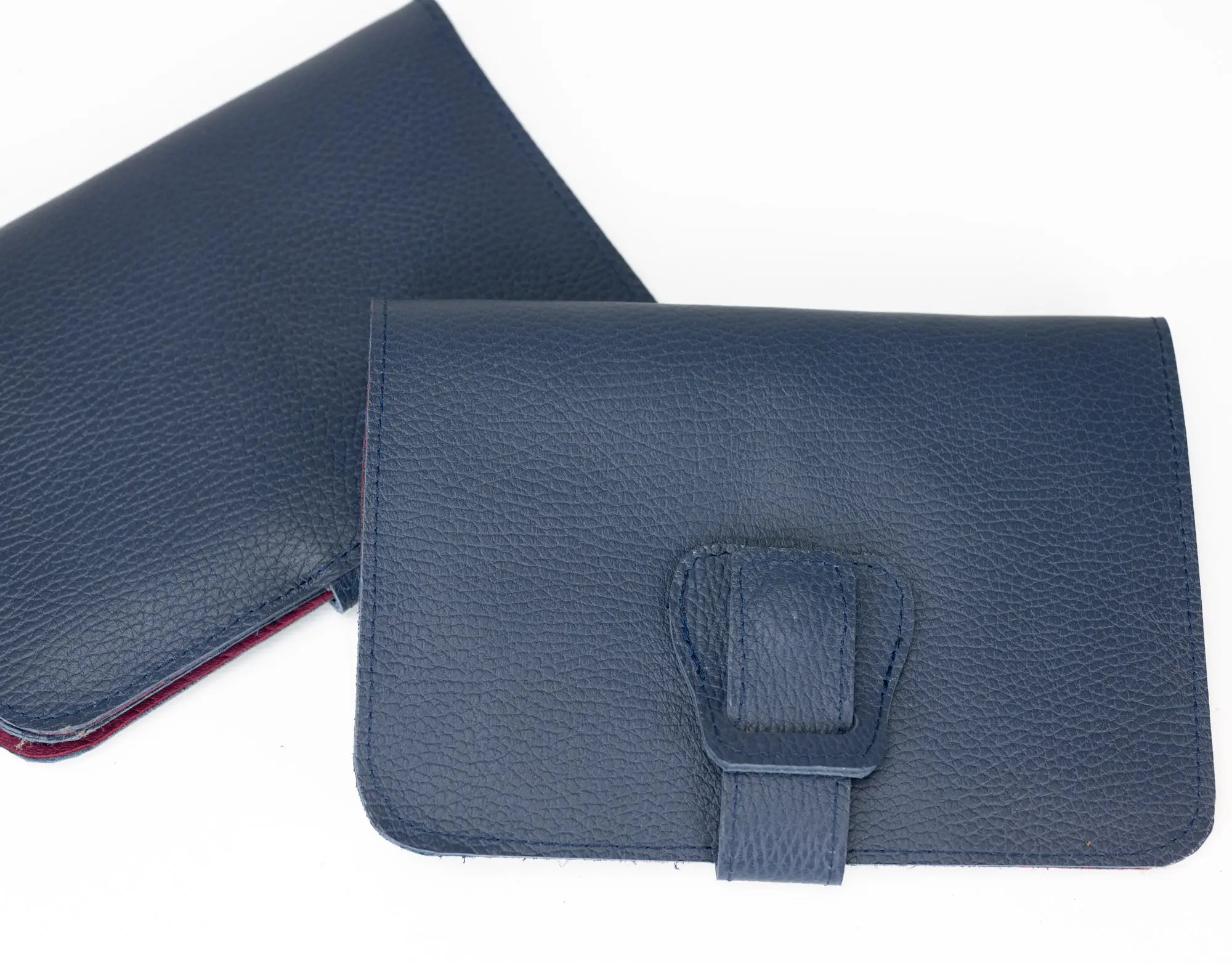 Blue leather pouch with a strap on a white background