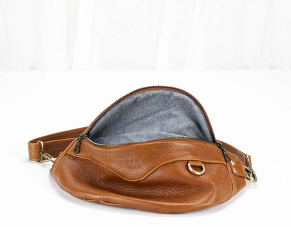 Brown leather bag with a white background