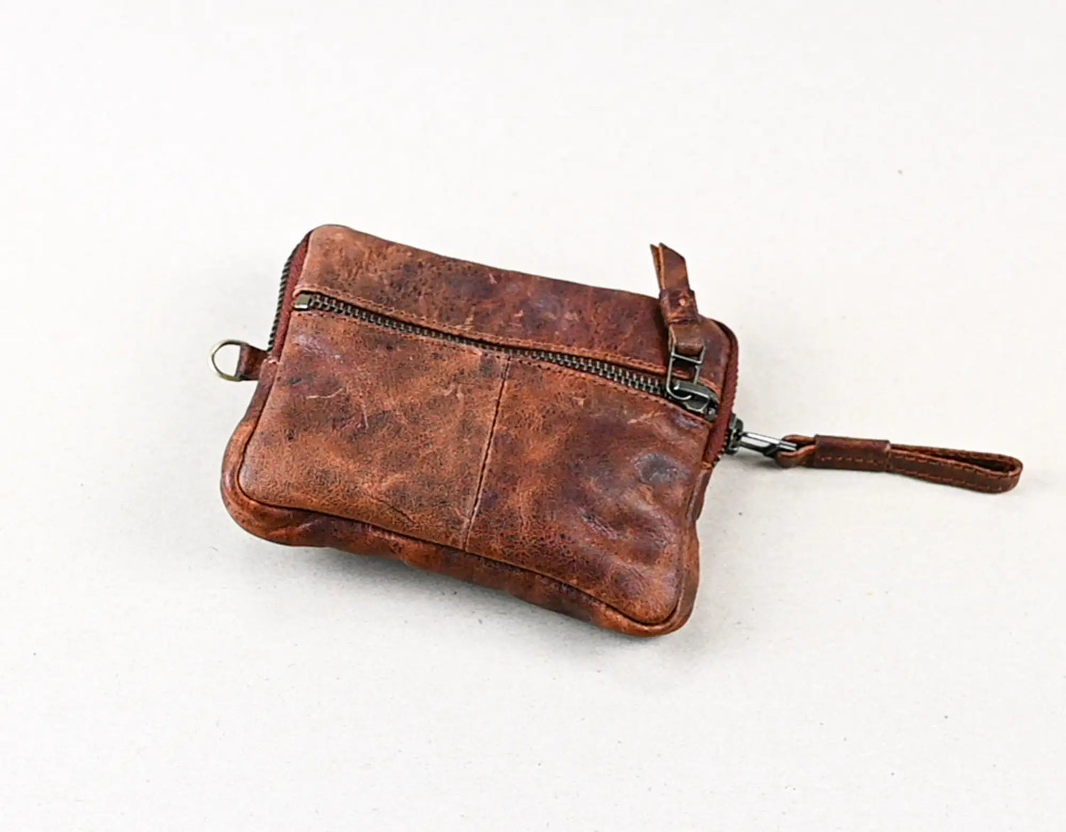 Brown leather crossbody bag on a white background