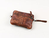 Brown leather crossbody bag on a white background