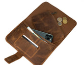 Brown leather wallet with phone and coins on a white background