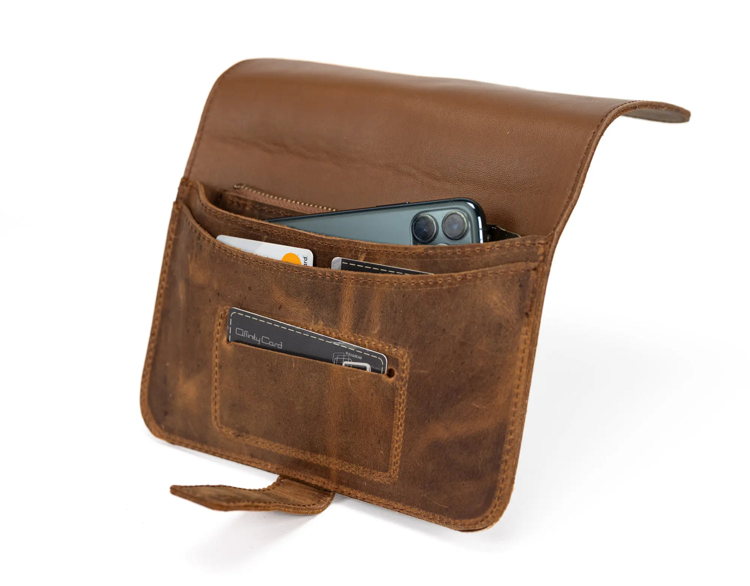 Brown leather pouch with a pocket holding a smartphone on a white background