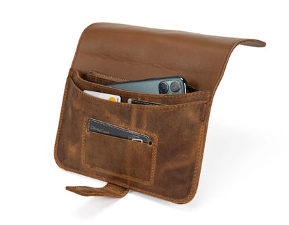 Brown leather pouch with a pocket holding a smartphone on a white background