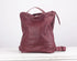Maroon leather backpack on a white background