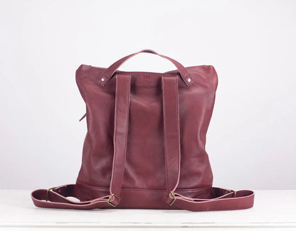 Maroon leather tote bag on a white background