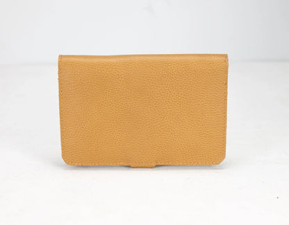 Tan leather wallet on a white background