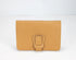 Yellow wallet with a buckle on a white background