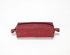 Red leather toiletry bag on a white background