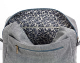 Gray backpack with floral lining on a white background
