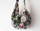 Floral patterned handbag on a white background