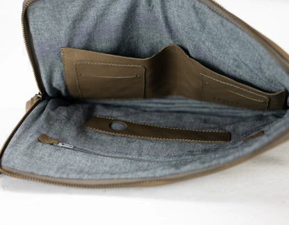 Gray fabric bag with a brown interior pocket on a white background