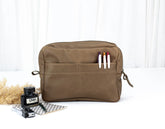 Khaki Brown toiletry bag with markers on a white background
