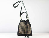 Black and plaid drawstring bag on a white background