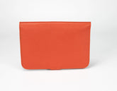 Orange leather wallet on a white background