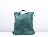 Green leather tote bag on a white background