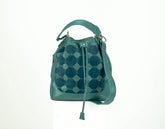 Teal patterned handbag on a white background