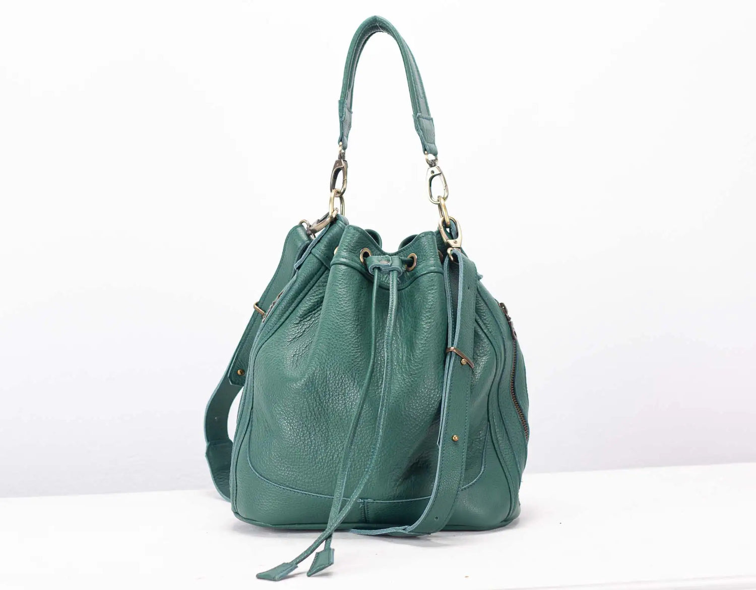 Green handbag on a white background