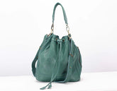 Green handbag on a white background