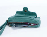 Teal leather wallet with a zipper on a white background