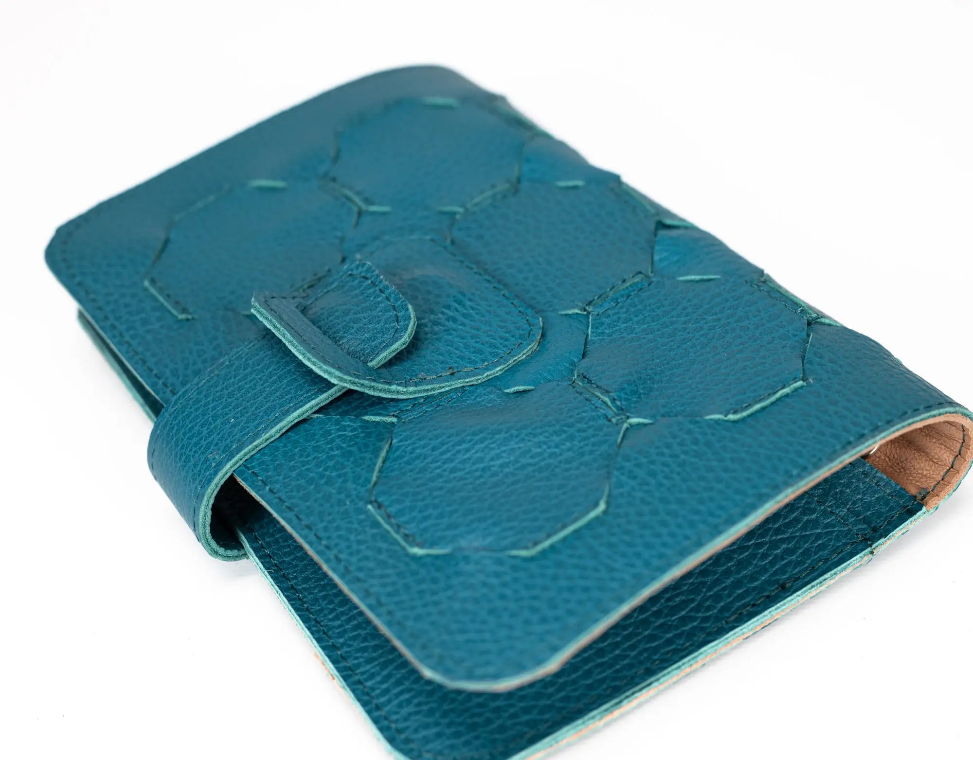 Blue textured leather wallet on a white background