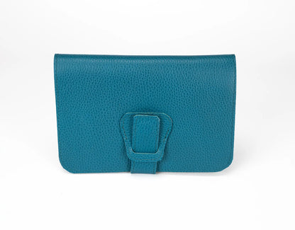 Teal clutch bag with a buckle on a white background