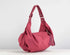 Pink handbag on a white background
