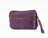 Purple leather pouch with a zipper on a white background