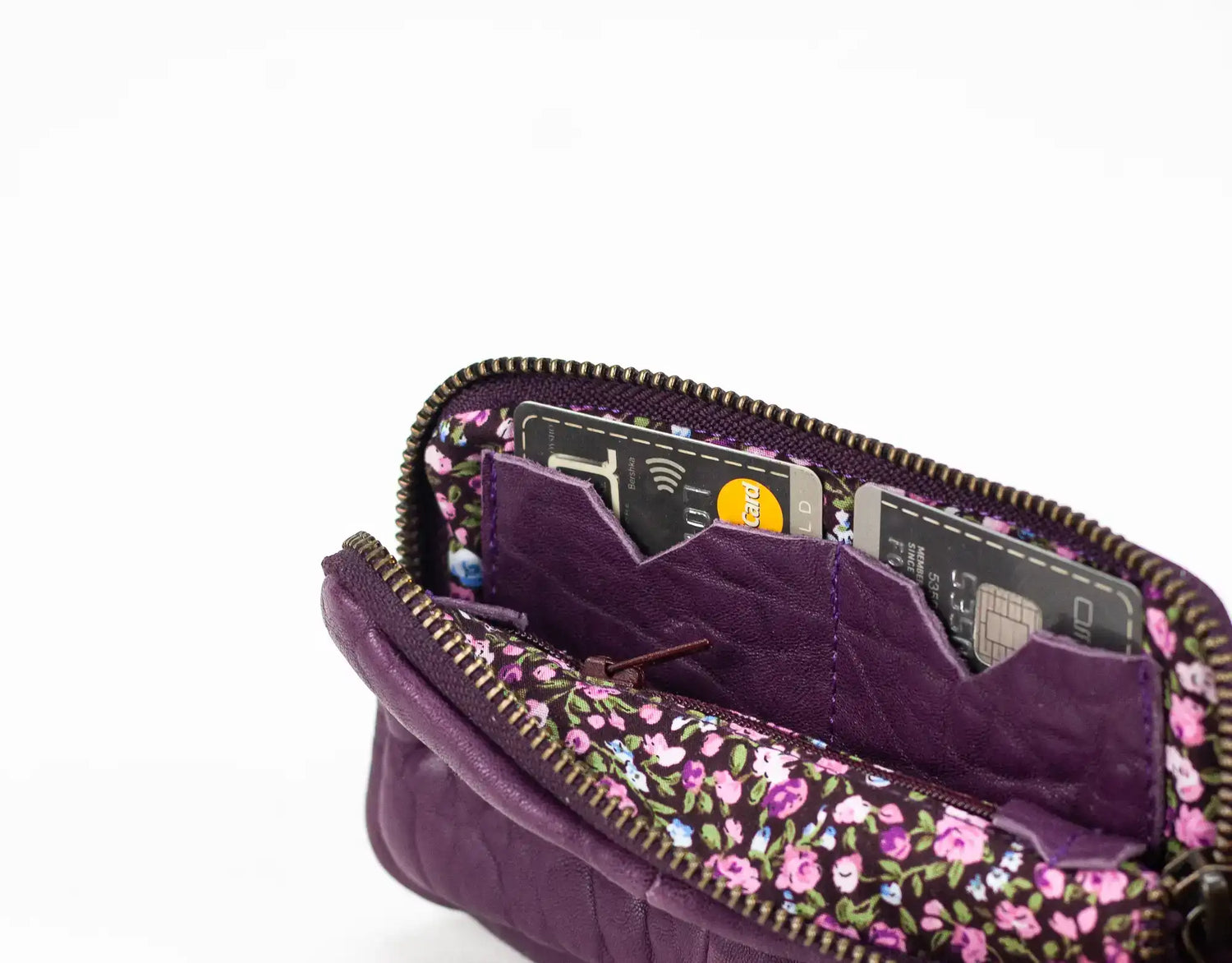 Purple floral-patterned wallet with card slots on a white background