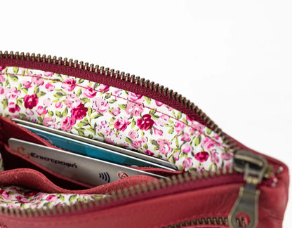 Floral-patterned wallet with visible cards on a white background