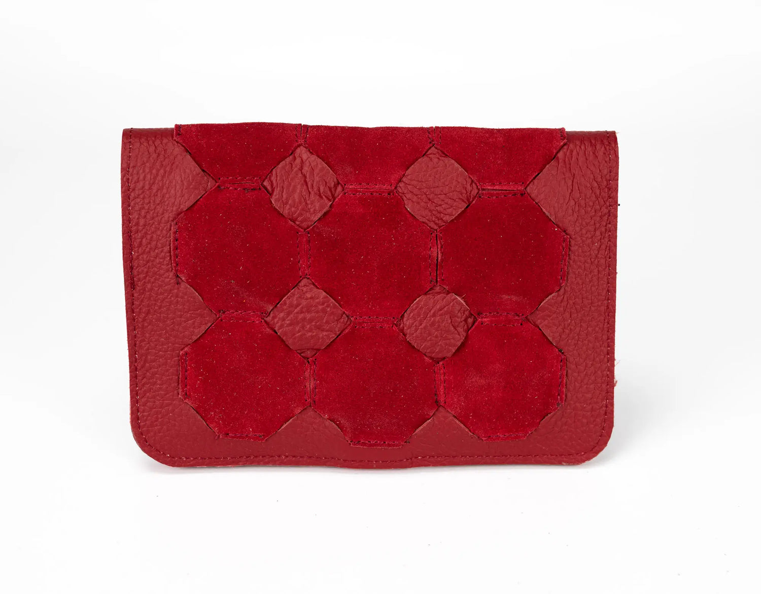 Red leather clutch with geometric pattern on a white background
