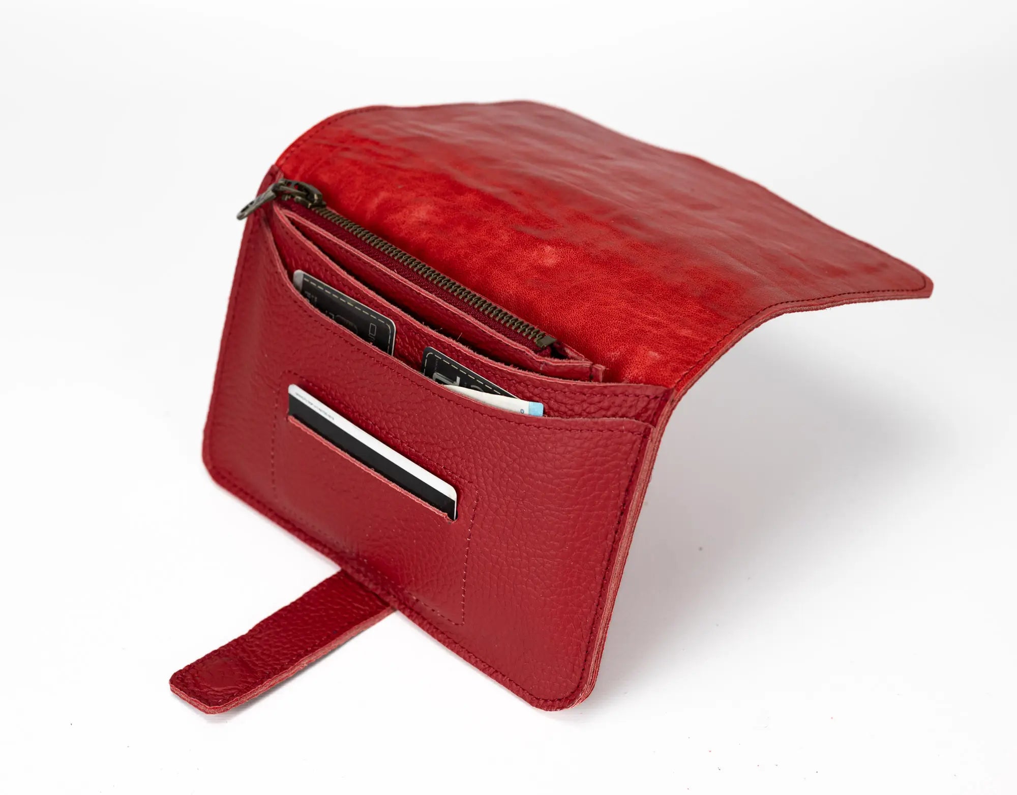 Red leather pouch with a zipper on a white background