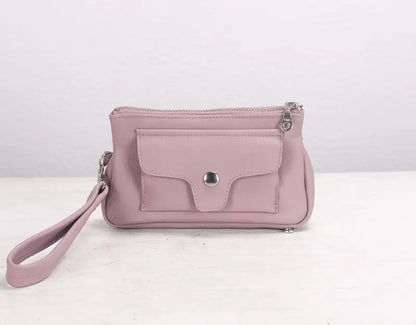 Pink handbag with a strap on a white background