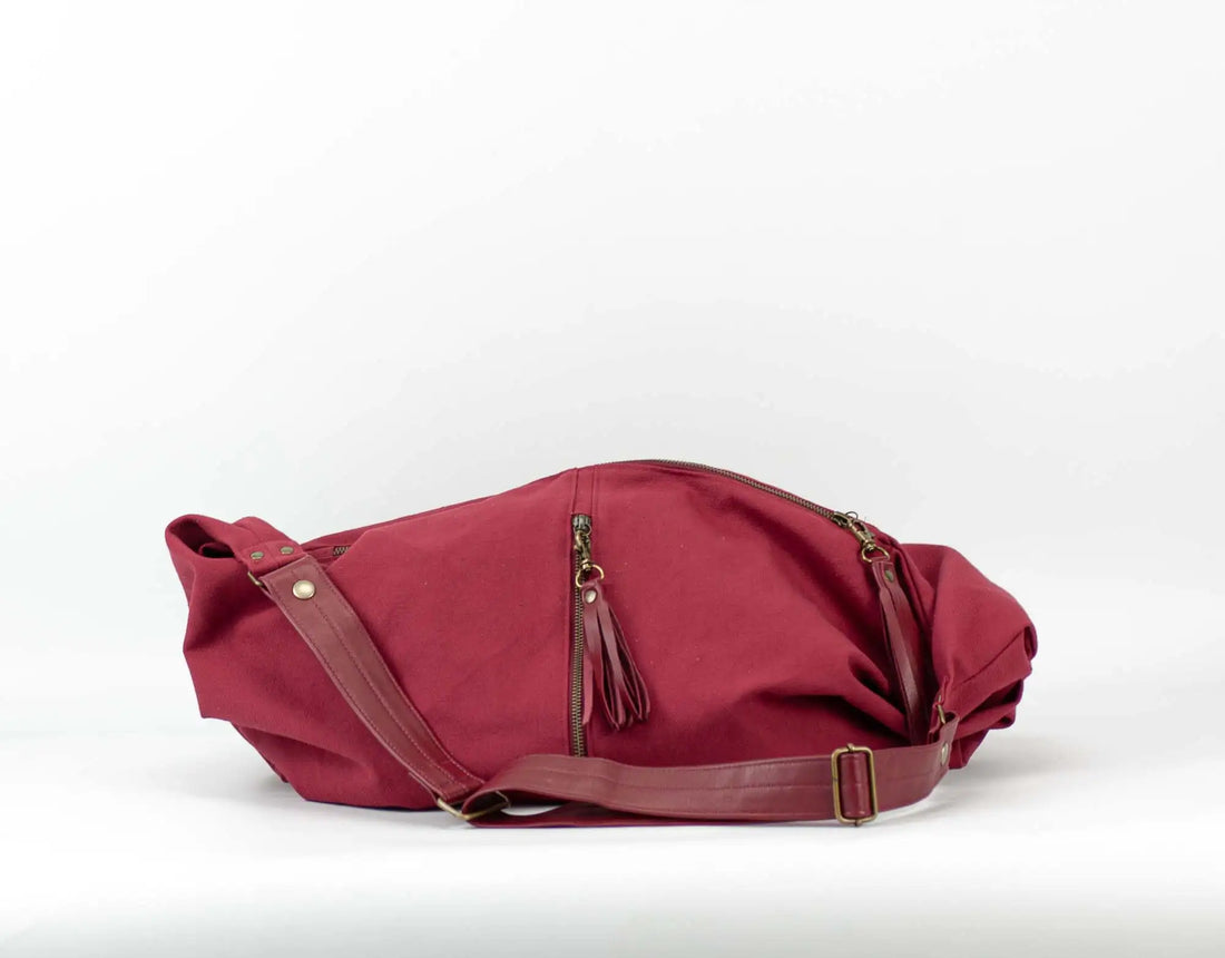 Red bag with a strap on a white background