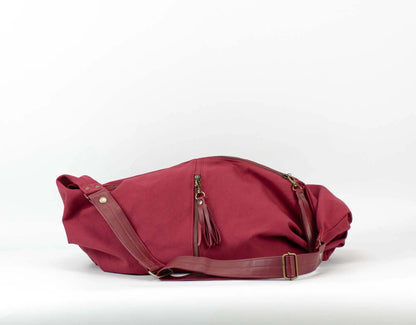 Red bag with a strap on a white background