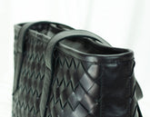 Black woven leather handbag 