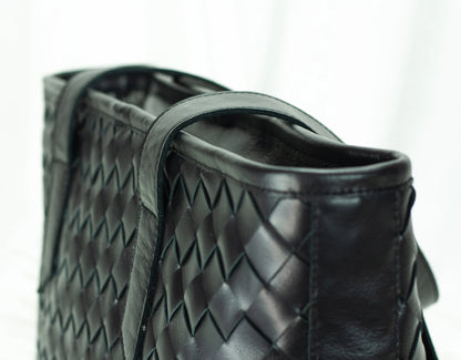 Black woven leather handbag 