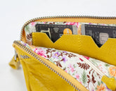 Yellow wallet with floral interior showing credit cards